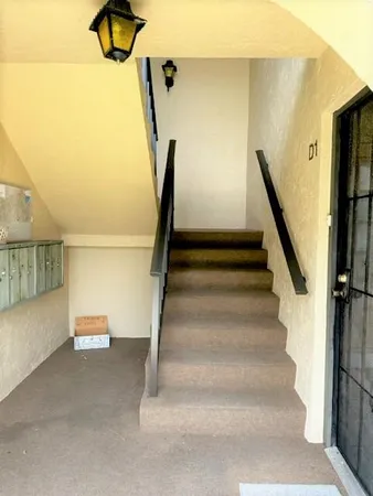 a view of a house with a small backyard