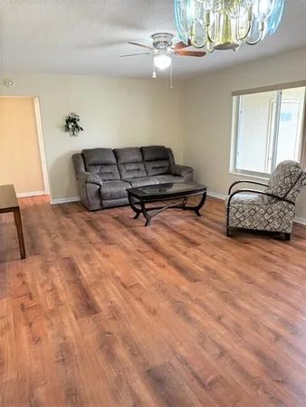 a kitchen with a sink a cabinets and window