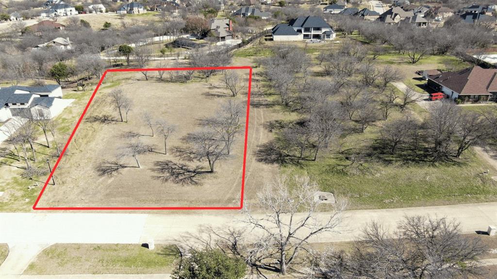 9108 Fossil Ridge Drive Grand Prairie, TX 75104 - Photo 10 of 10 Aerial view of residential area with property boundaries highlighted