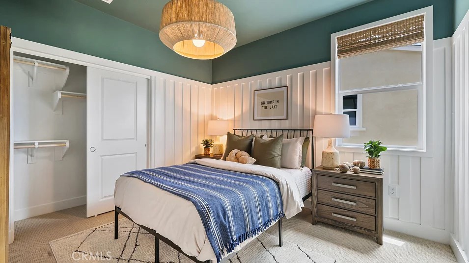 27463 Sand Almond Way Newhall, CA 91381 - Photo 12 of 26 a bedroom with a bed and a chandelier