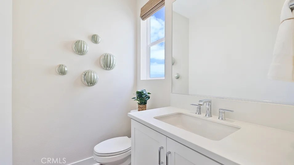 27463 Sand Almond Way Newhall, CA 91381 - Photo 7 of 26 a bathroom with a sink toilet and mirror