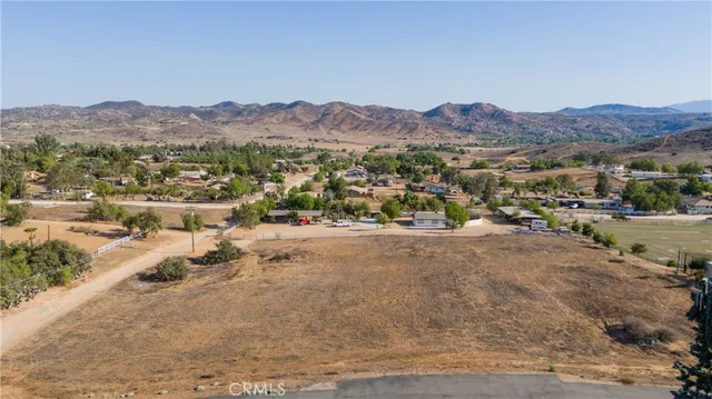 a view of a town with mountains in the background