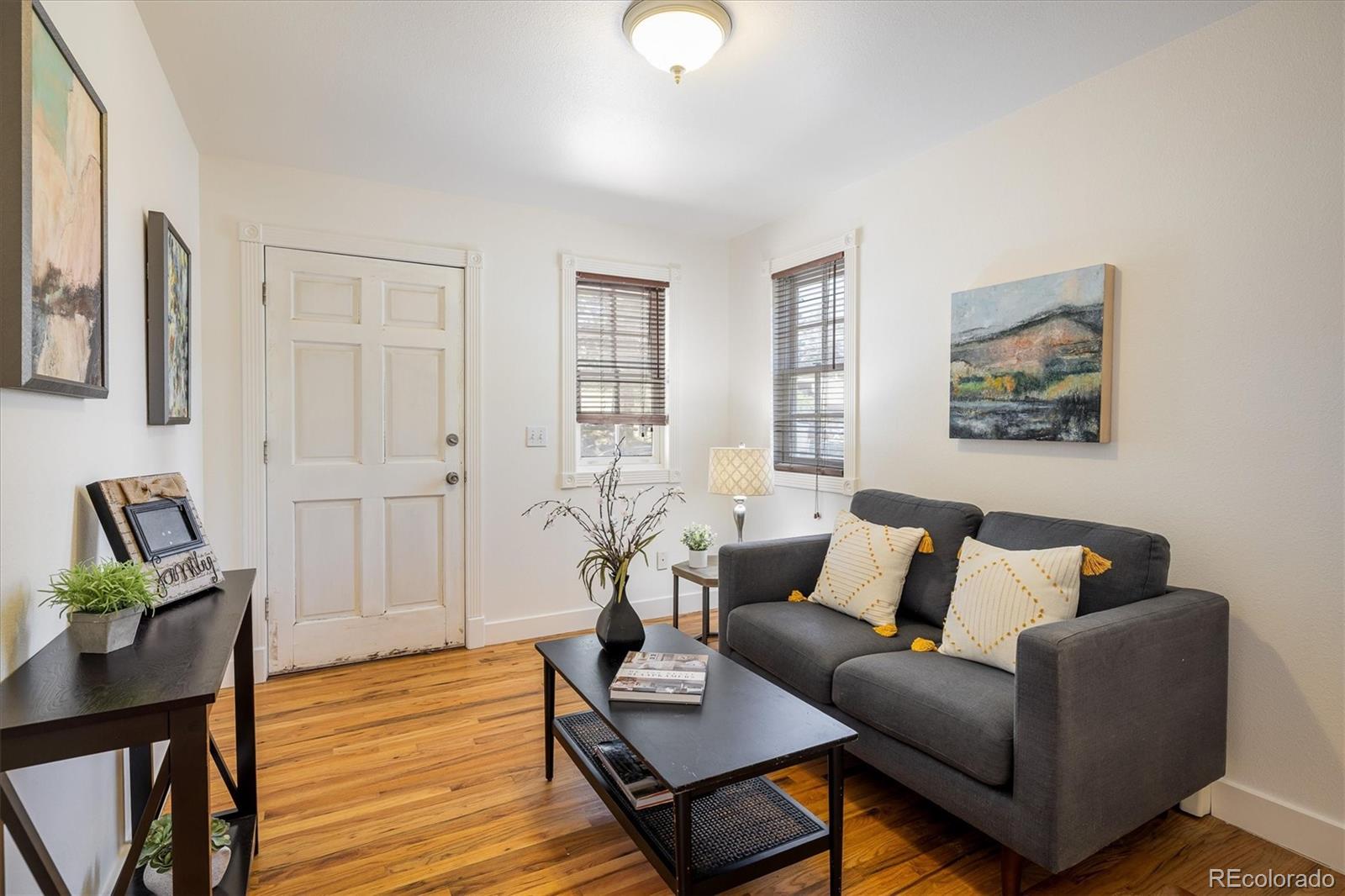 855 Main Street Boulder, CO 80302 - Photo 12 of 41 a living room with furniture and wooden floor