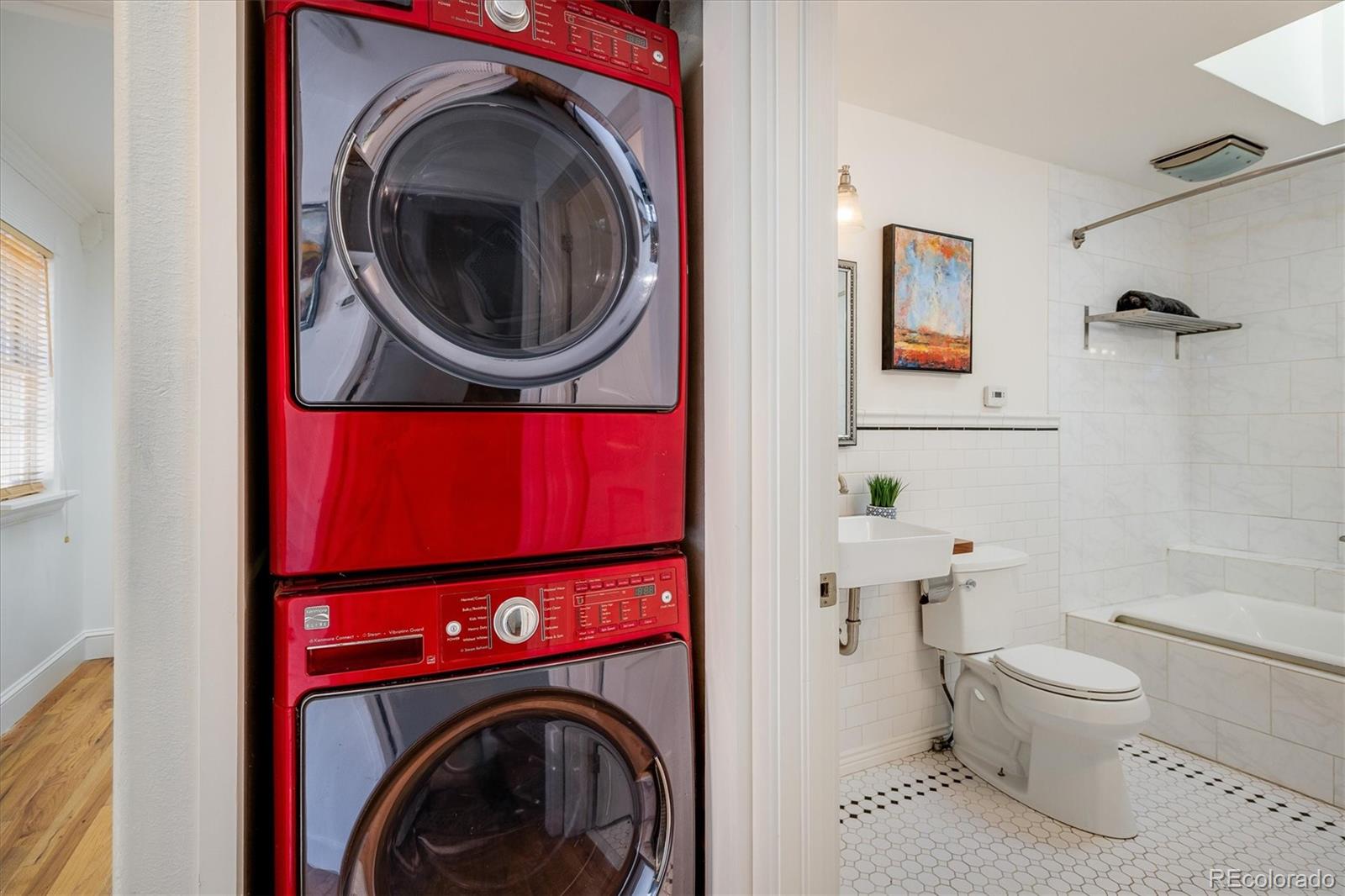 855 Main Street Boulder, CO 80302 - Photo 15 of 41 a utility room with dryer washer and a view of bathroom