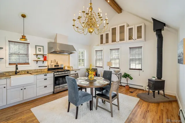 a kitchen with granite countertop lots of counter top space and dining table