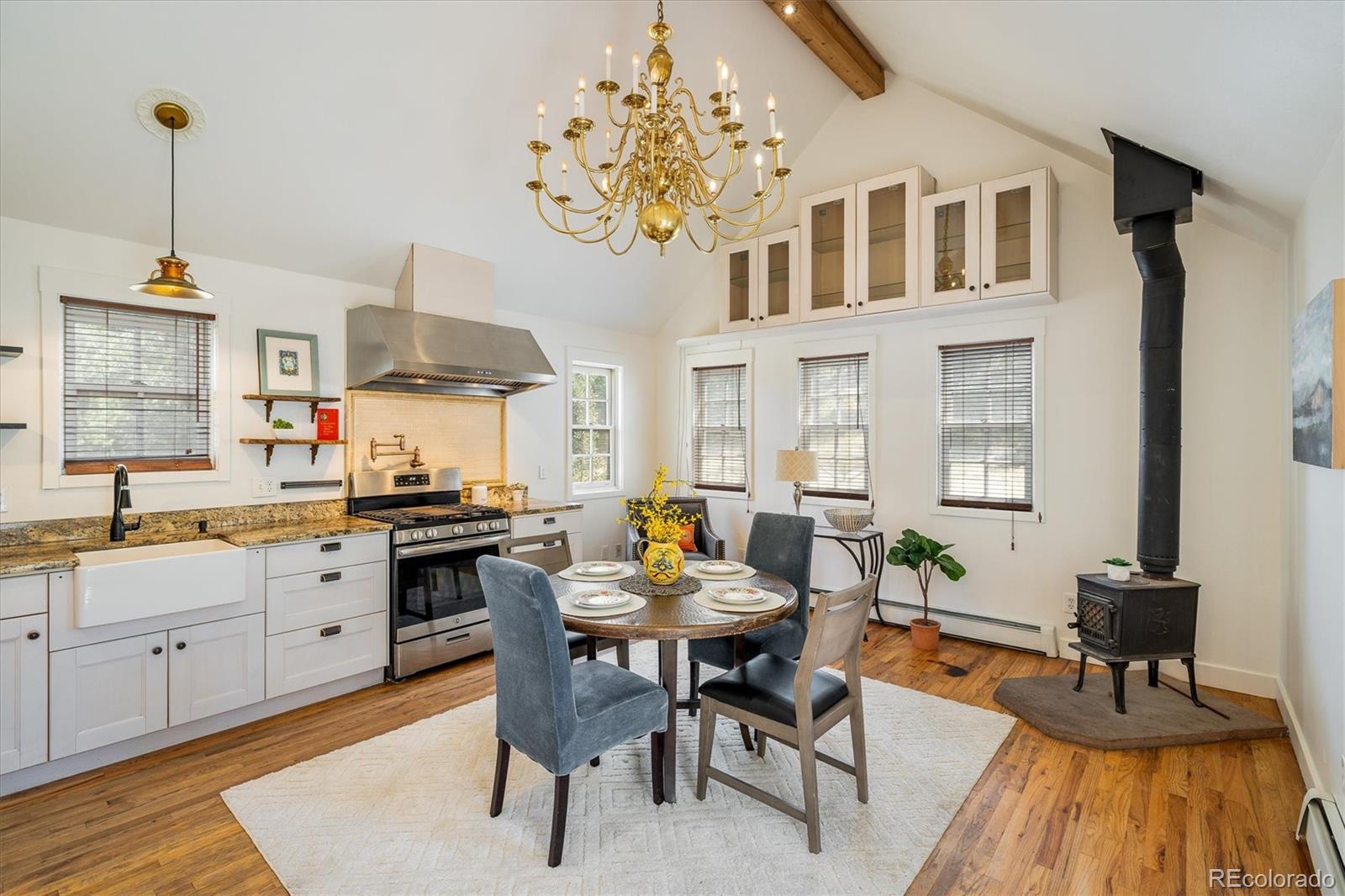 855 Main Street Boulder, CO 80302 - Photo 2 of 41 a kitchen with granite countertop lots of counter top space and dining table