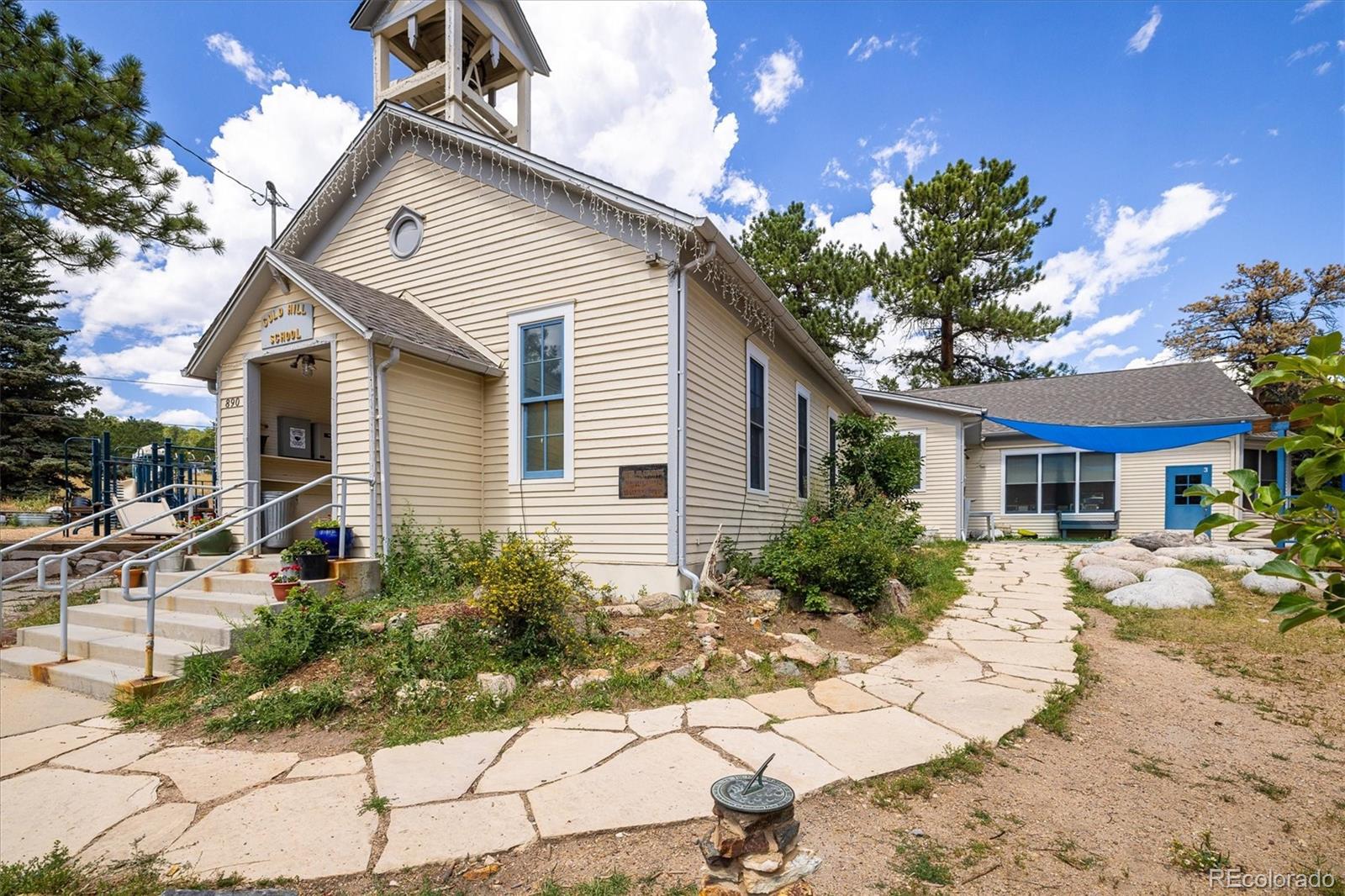 855 Main Street Boulder, CO 80302 - Photo 25 of 41 a front view of a house with a yard