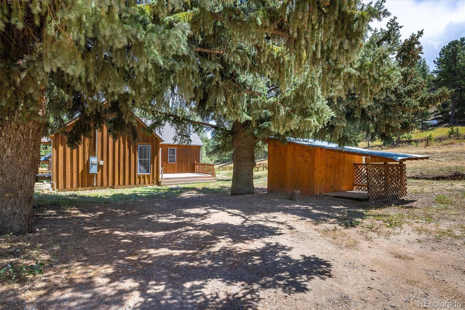 855 Main Street Boulder, CO 80302 - Photo 26 of 41 a view of a yard with large tree
