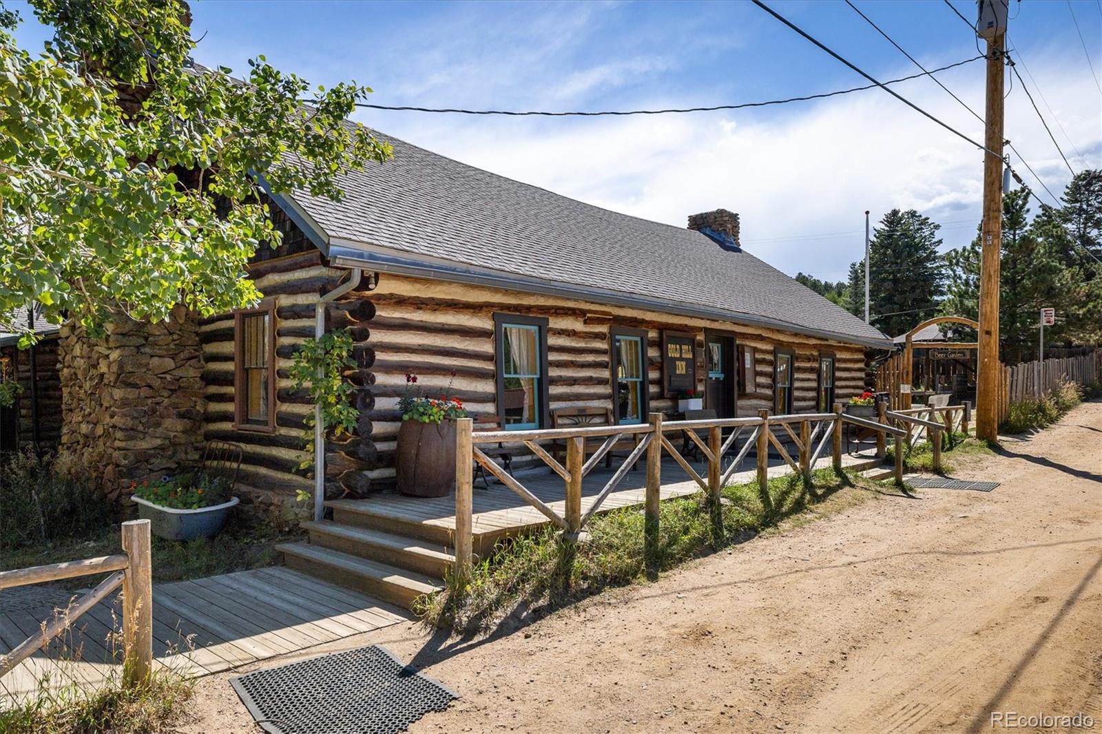 855 Main Street Boulder, CO 80302 - Photo 30 of 41 a wooden bench sitting in front of a building