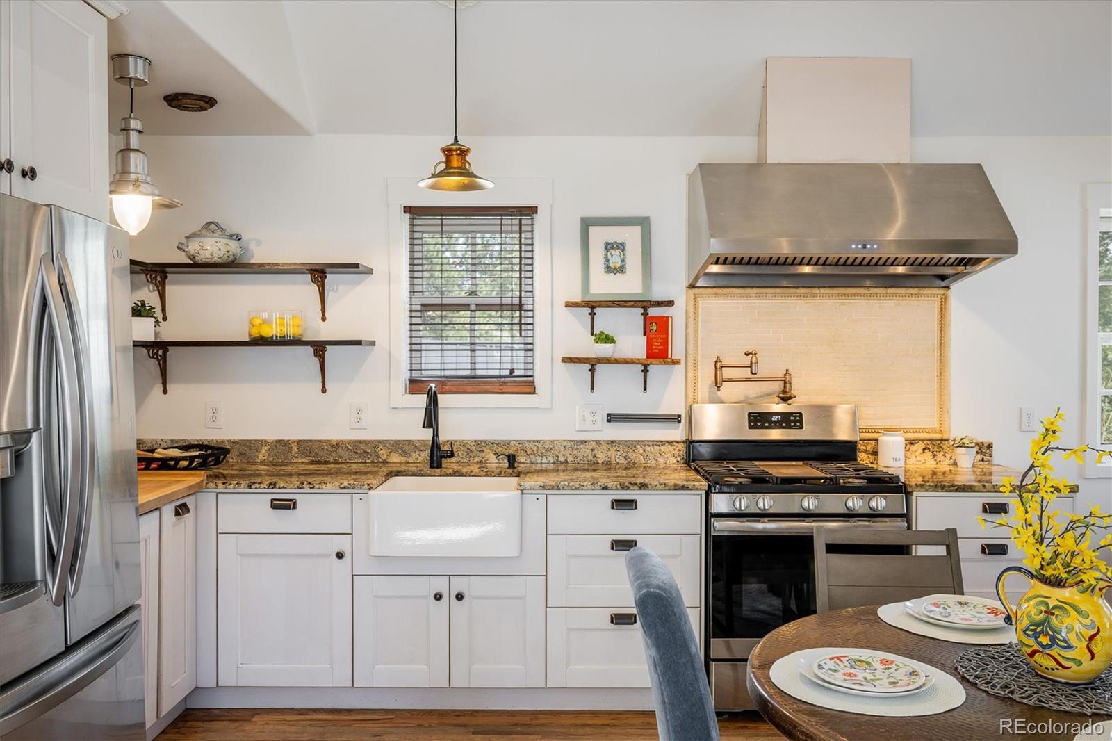 855 Main Street Boulder, CO 80302 - Photo 3 of 41 a kitchen with a stove a sink and a refrigerator