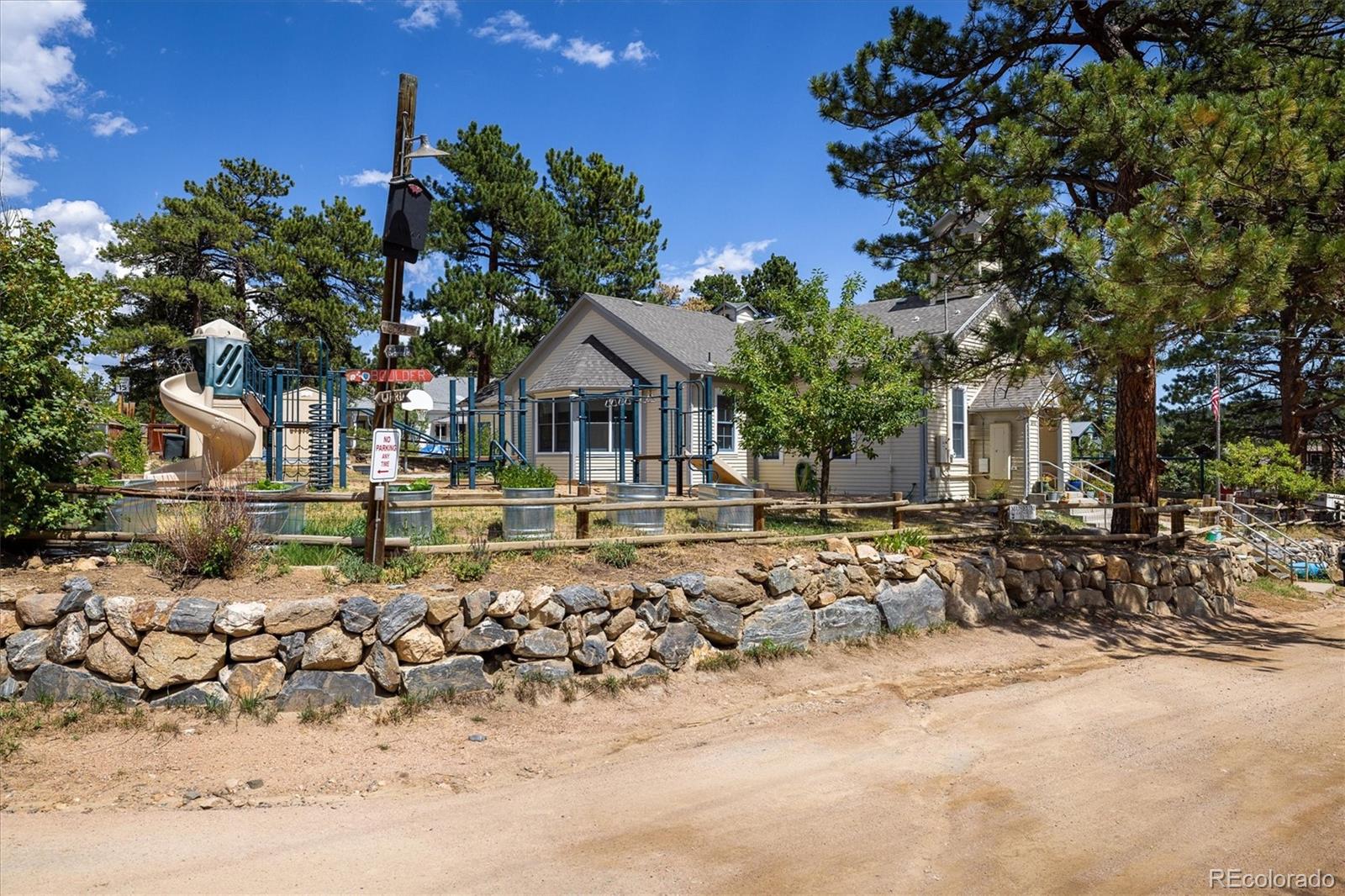 855 Main Street Boulder, CO 80302 - Photo 32 of 41 a front view of a house with a yard