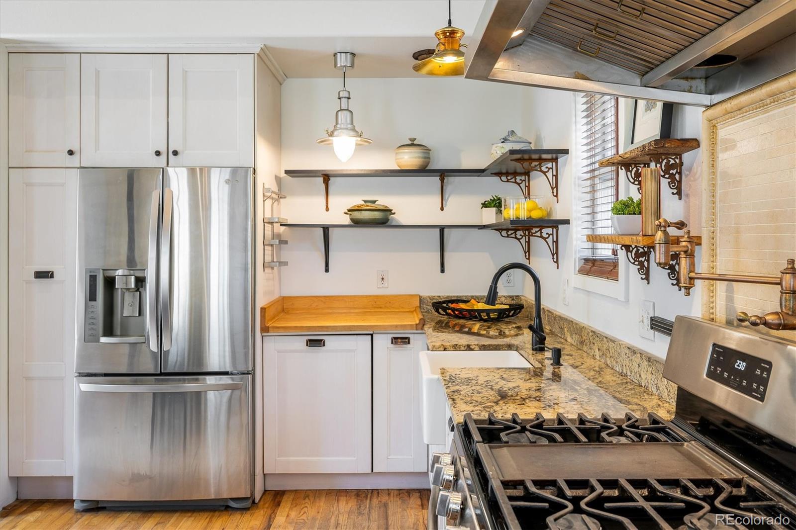 855 Main Street Boulder, CO 80302 - Photo 5 of 41 a kitchen with stainless steel appliances granite countertop a refrigerator and a stove