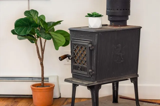 a vase of flowers sitting on a table with a mirror