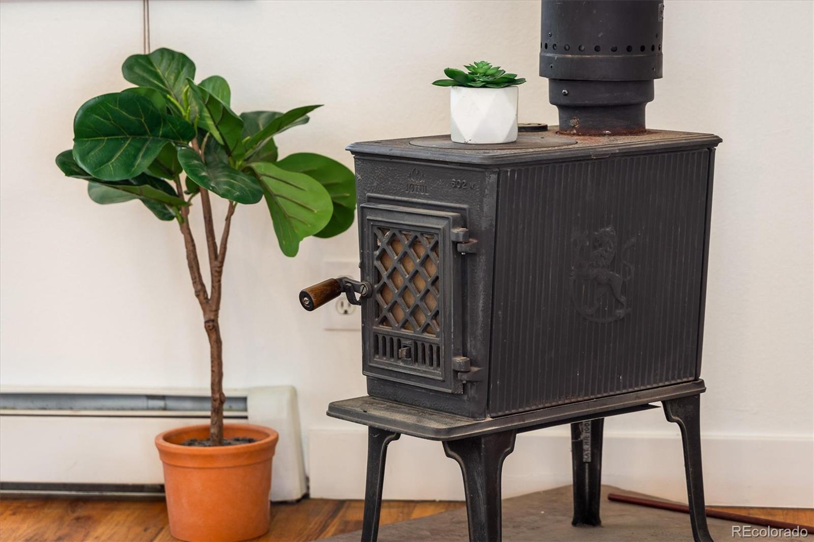 855 Main Street Boulder, CO 80302 - Photo 8 of 41 a vase of flowers sitting on a table with a mirror