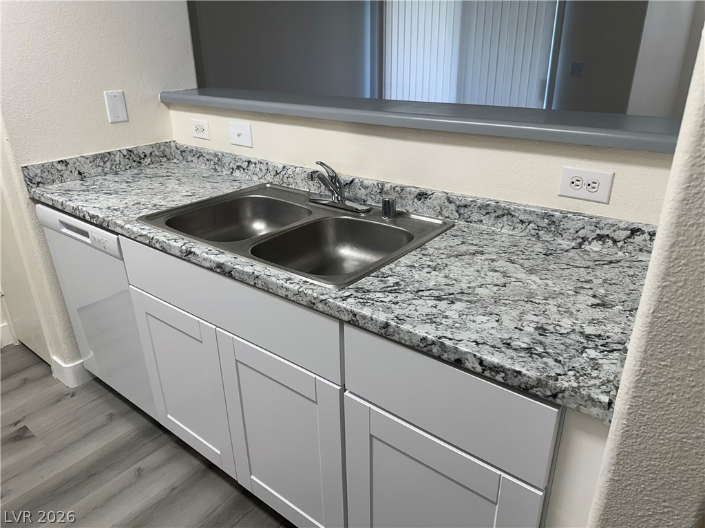 7255 West Sunset Road, Unit 2006 Las Vegas, NV 89113 - Photo 8 of 24 A well-appointed kitchen features a double basin sink and a convenient dishwasher.