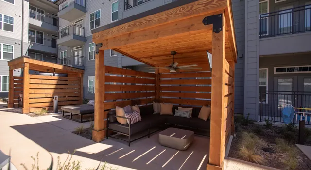 a view of a patio with a table and chairs