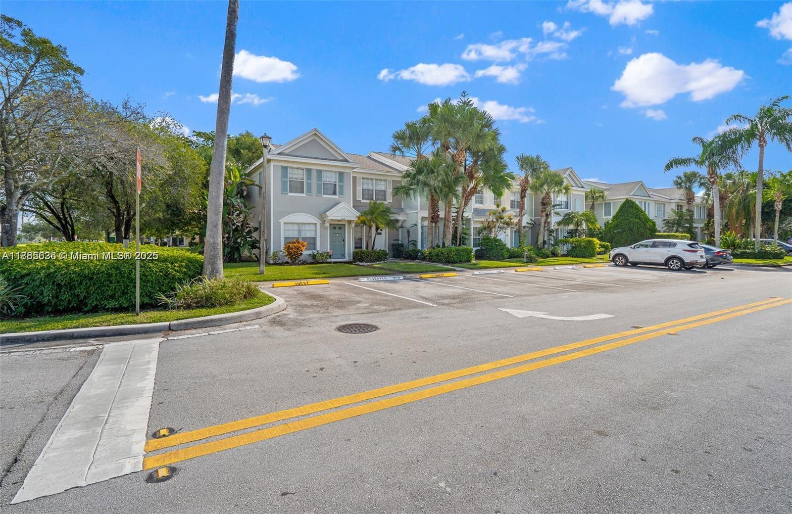 8066 Sanibel Drive, Unit 8066 Tamarac, FL 33321 - Photo 4 of 23 a view of a street with houses on both side