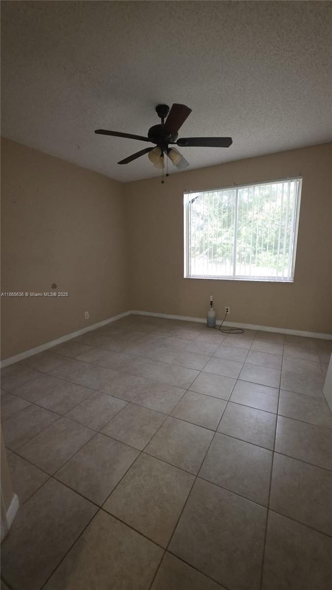 8066 Sanibel Drive, Unit 8066 Tamarac, FL 33321 - Photo 7 of 23 a view of an empty room with a window