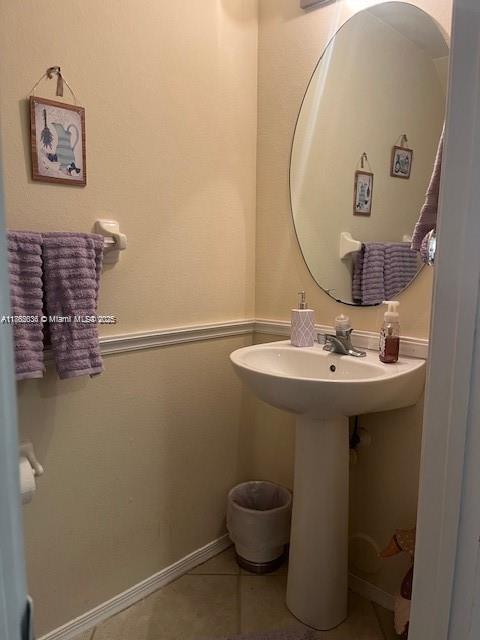 8066 Sanibel Drive, Unit 8066 Tamarac, FL 33321 - Photo 9 of 23 a bathroom with a sink and mirror