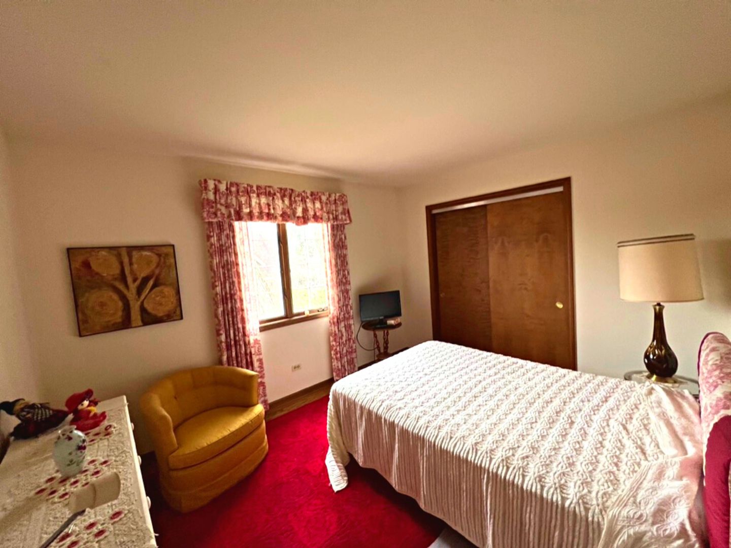 910 North Prospect Avenue Park Ridge, IL 60068 - Photo 12 of 18 a bedroom with a bed flat screen tv and window