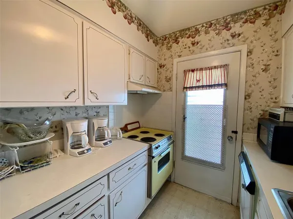 a kitchen with stainless steel appliances a sink a stove and a refrigerator