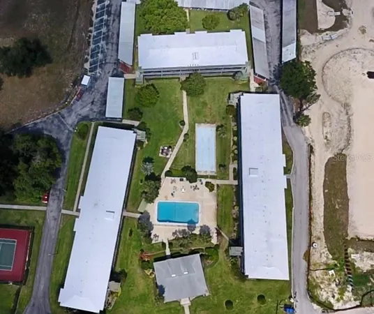 an aerial view of a house with a swimming pool
