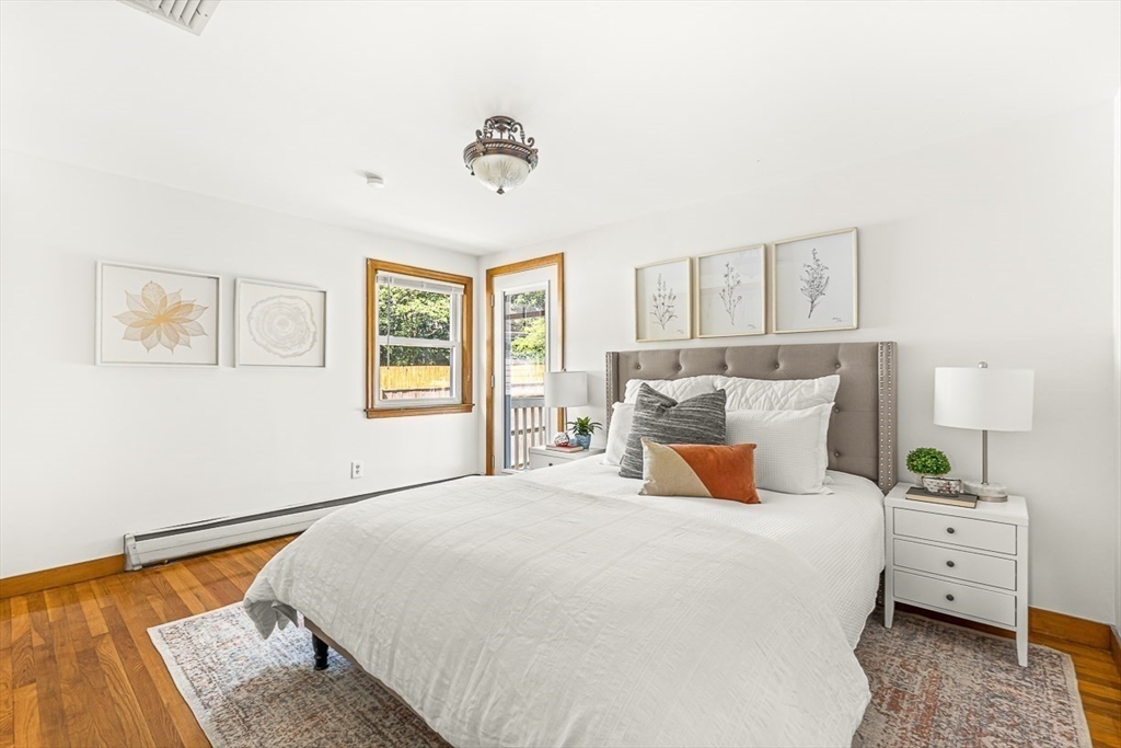 25 Grandview Street Boston, MA 02131 - Photo 11 of 20 a bedroom with a bed and wooden floor