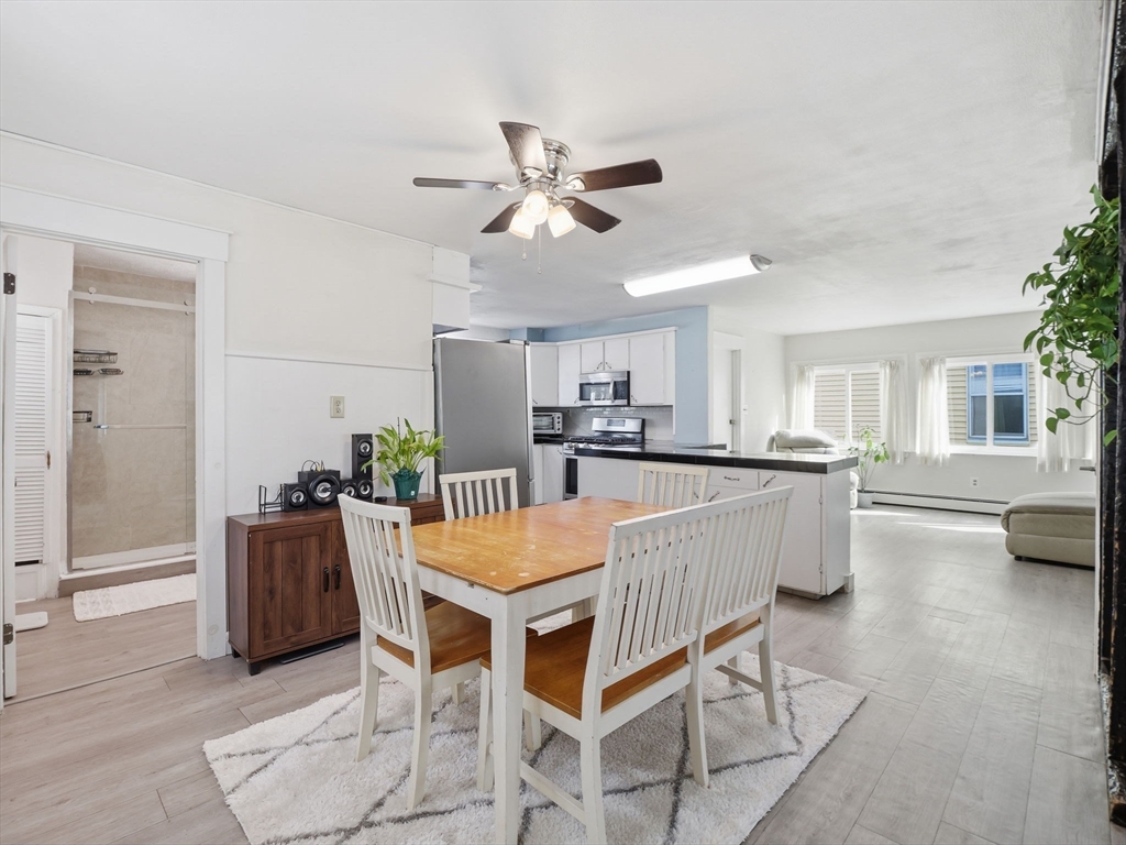 28 Court Street Lowell, MA 01852 - Photo 13 of 42 a dining room with furniture and window