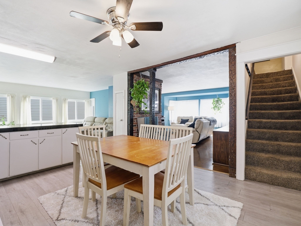 28 Court Street Lowell, MA 01852 - Photo 14 of 42 a view of a dining room with furniture and a chandelier
