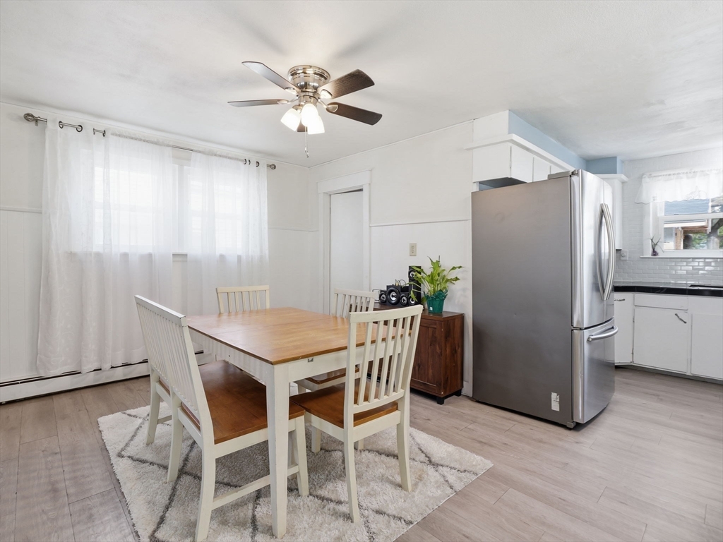 28 Court Street Lowell, MA 01852 - Photo 15 of 42 a view of a dining room with furniture and wooden floor
