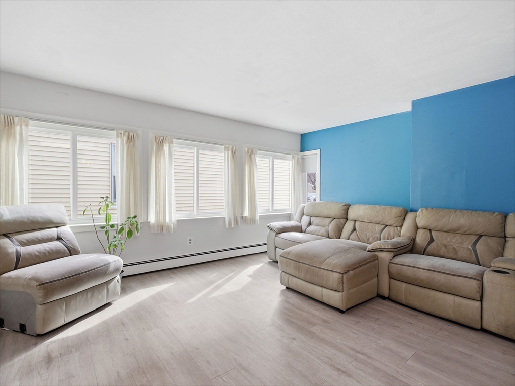 28 Court Street Lowell, MA 01852 - Photo 18 of 42 a living room with furniture and windows