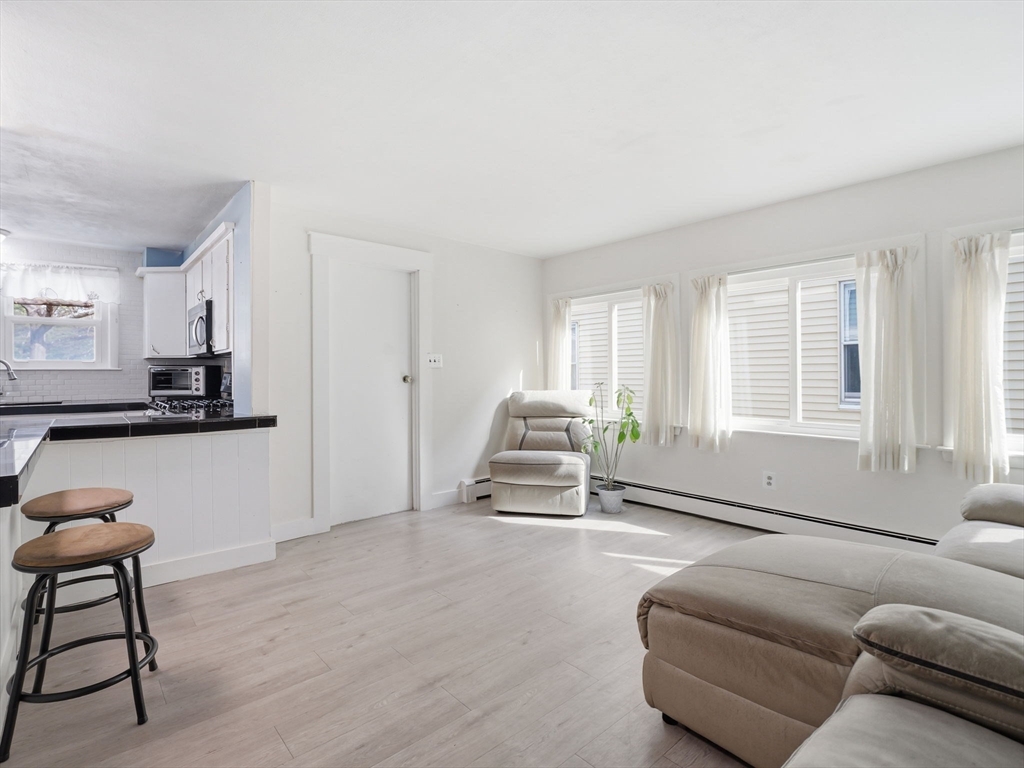 28 Court Street Lowell, MA 01852 - Photo 20 of 42 a living room with furniture and a window