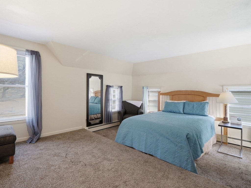 28 Court Street Lowell, MA 01852 - Photo 23 of 42 a bedroom with a bed and a window