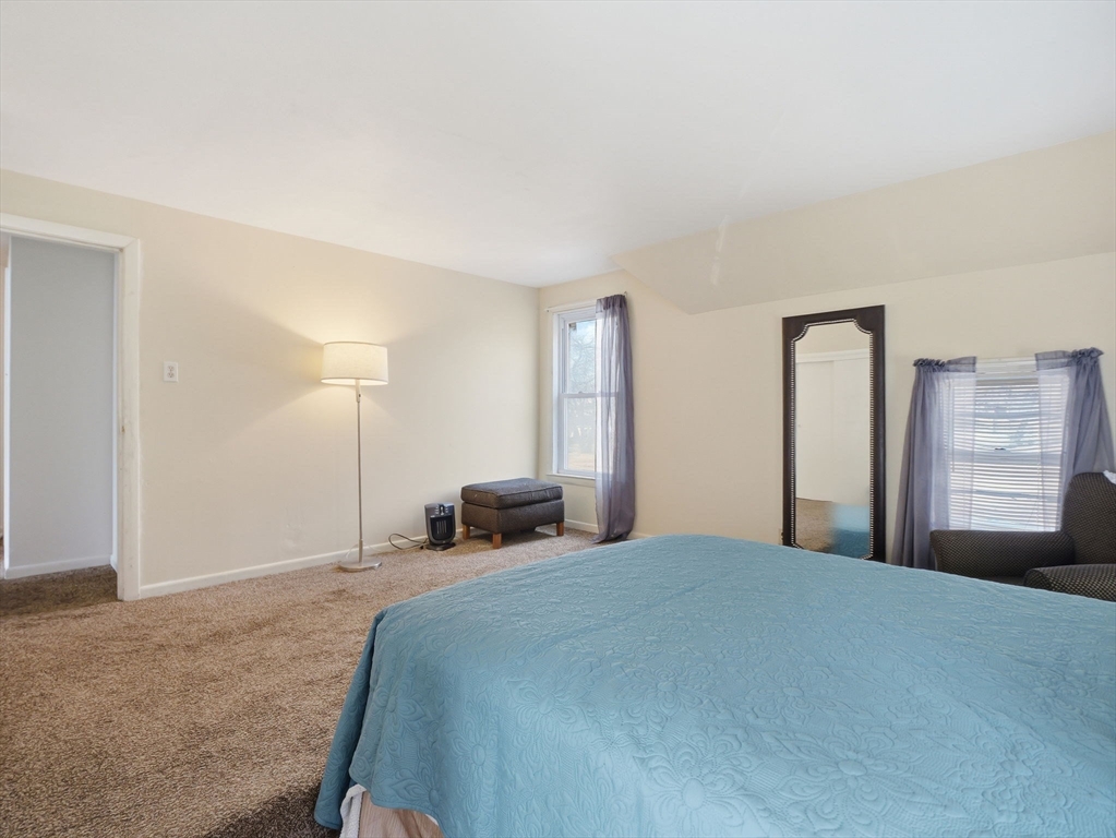 28 Court Street Lowell, MA 01852 - Photo 24 of 42 a bedroom with a bed and a window