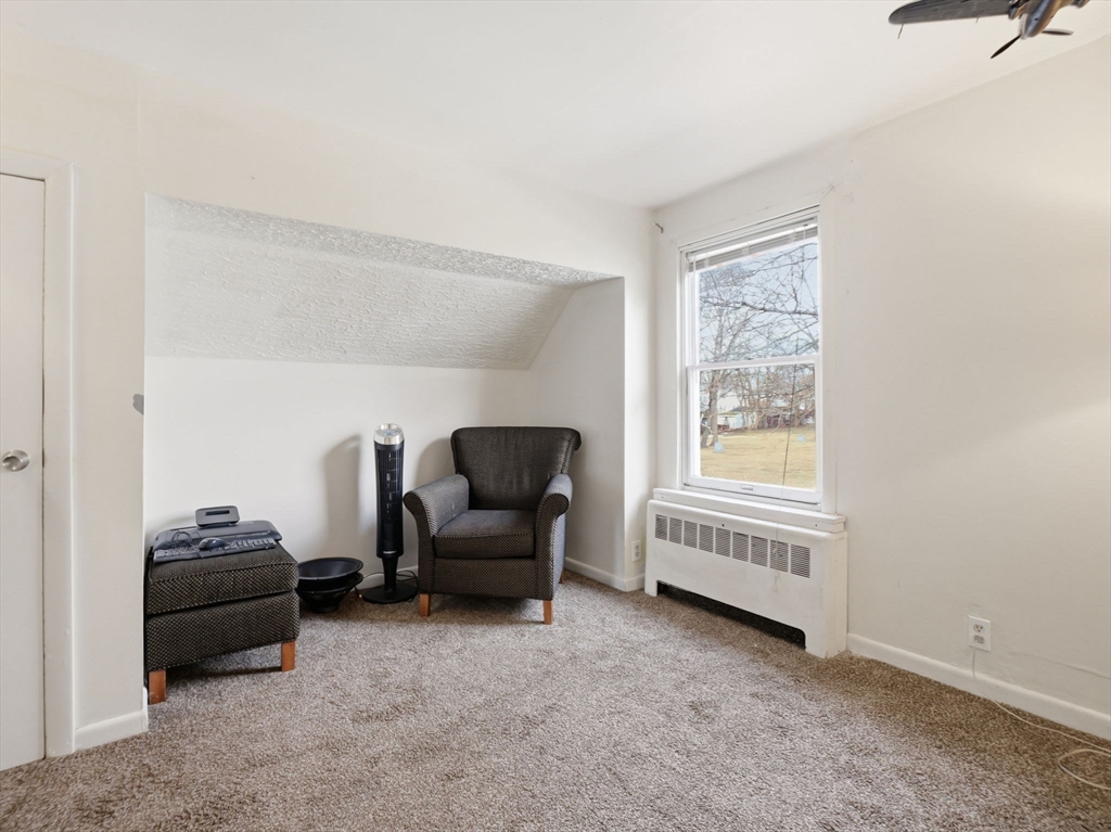 28 Court Street Lowell, MA 01852 - Photo 32 of 42 a living room with furniture and a window