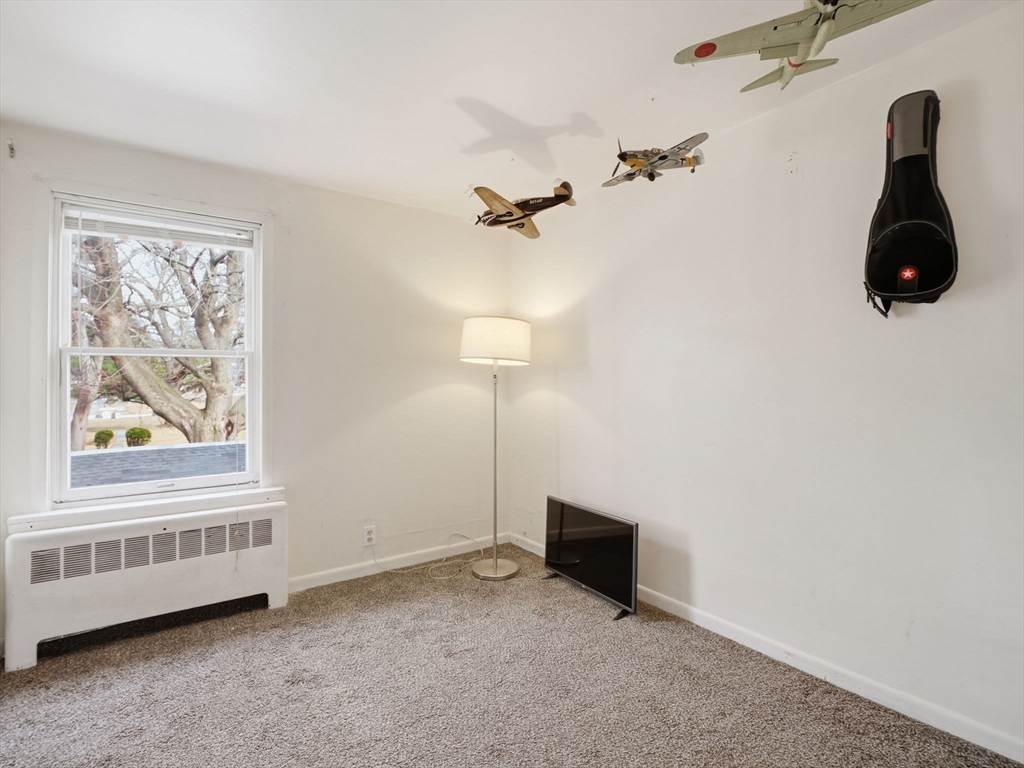 28 Court Street Lowell, MA 01852 - Photo 33 of 42 an empty room with windows and fan