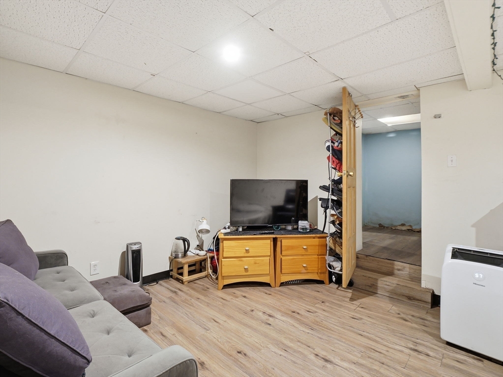 28 Court Street Lowell, MA 01852 - Photo 35 of 42 a living room with furniture and a flat screen tv