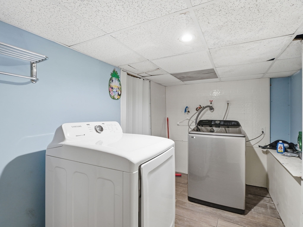 28 Court Street Lowell, MA 01852 - Photo 36 of 42 a utility room with dryer and washer