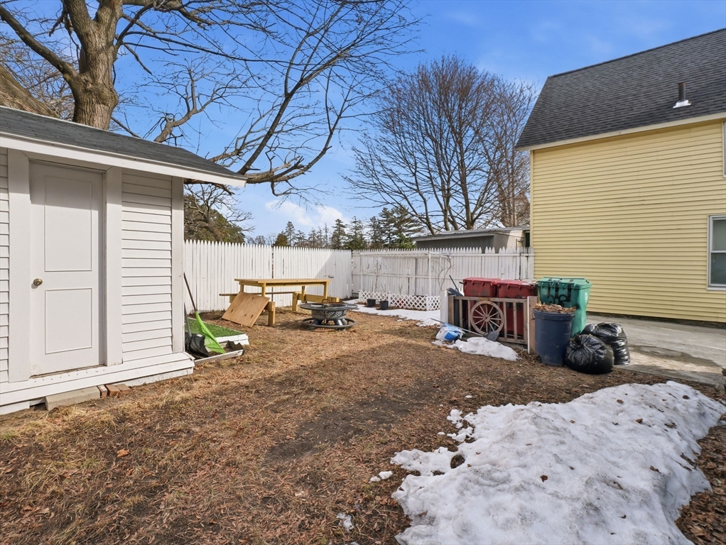 28 Court Street Lowell, MA 01852 - Photo 37 of 42 a view of a backyard with table and chairs and ice snow