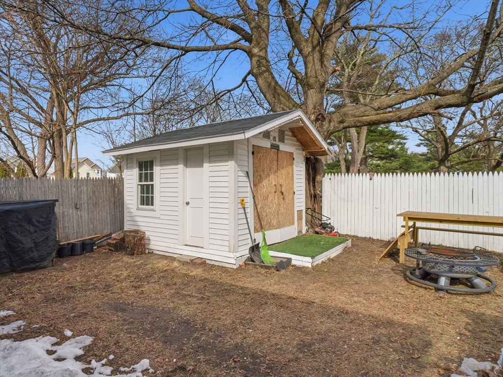 28 Court Street Lowell, MA 01852 - Photo 38 of 42 a view of a chair and table in backyard
