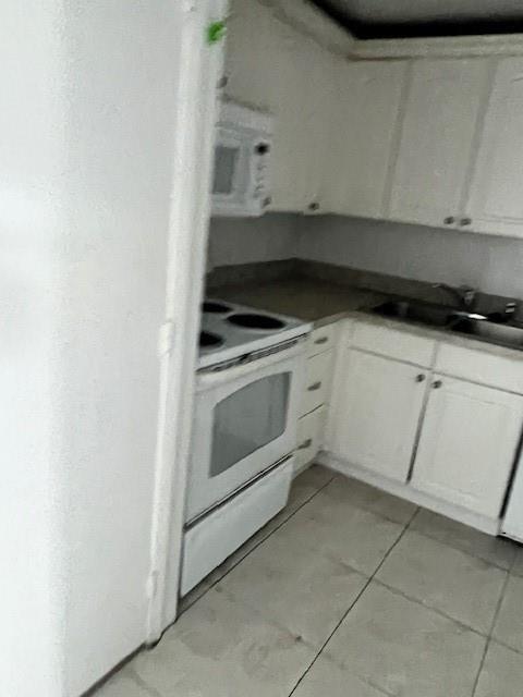 4164 Inverrary Drive, Unit 803 Lauderhill, FL 33319 - Photo 3 of 16 a white stove top oven sitting inside of a kitchen