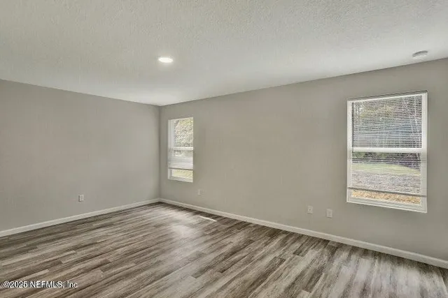 a bedroom with a bed and a desk