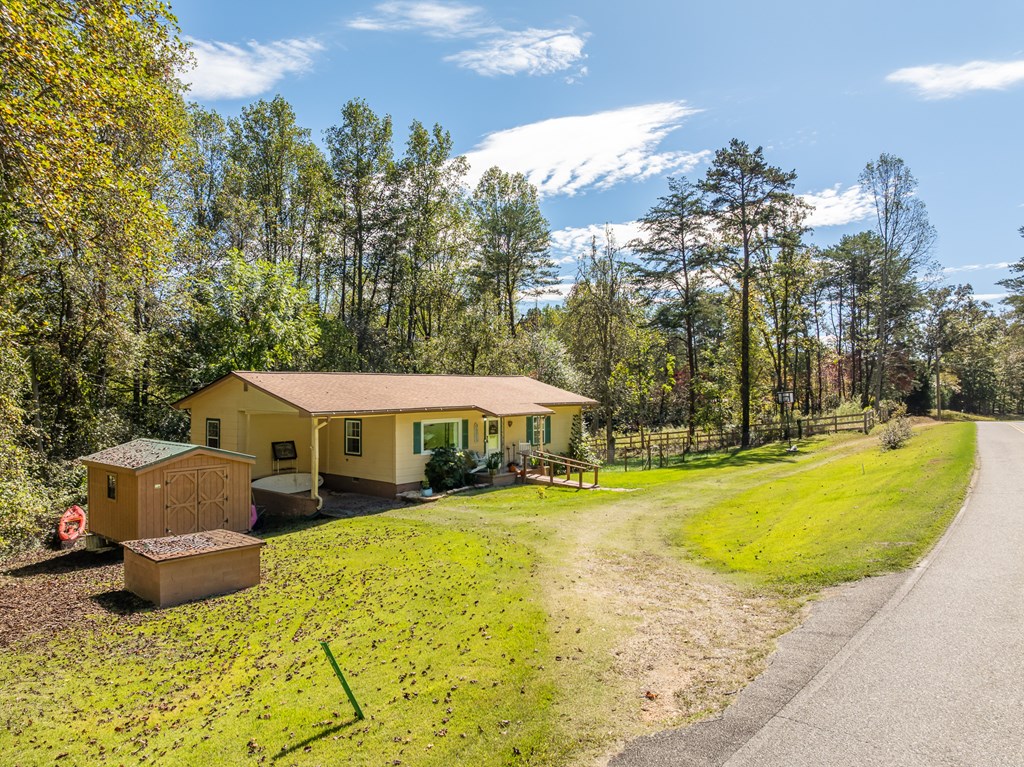 1813 John Smith Road East Blairsville, GA 30512 - Photo 29 of 41 a view of a house with swimming pool and sitting area