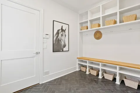 a view of a door and chair in a room