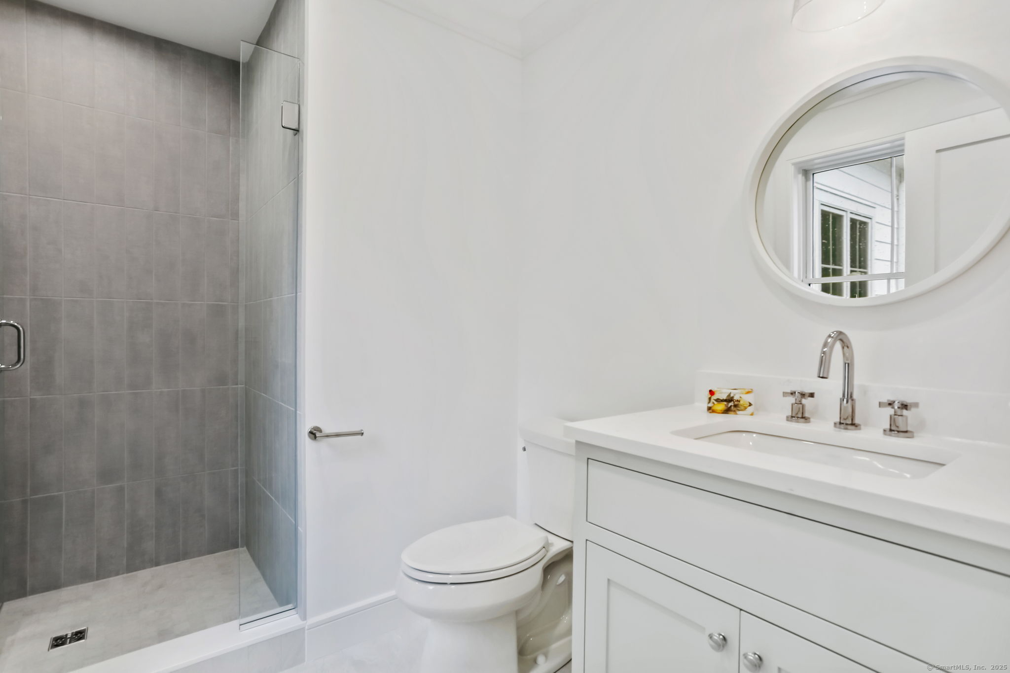 45 Robin Circle Fairfield, CT 06824 - Photo 28 of 40 a bathroom with a sink a toilet and shower