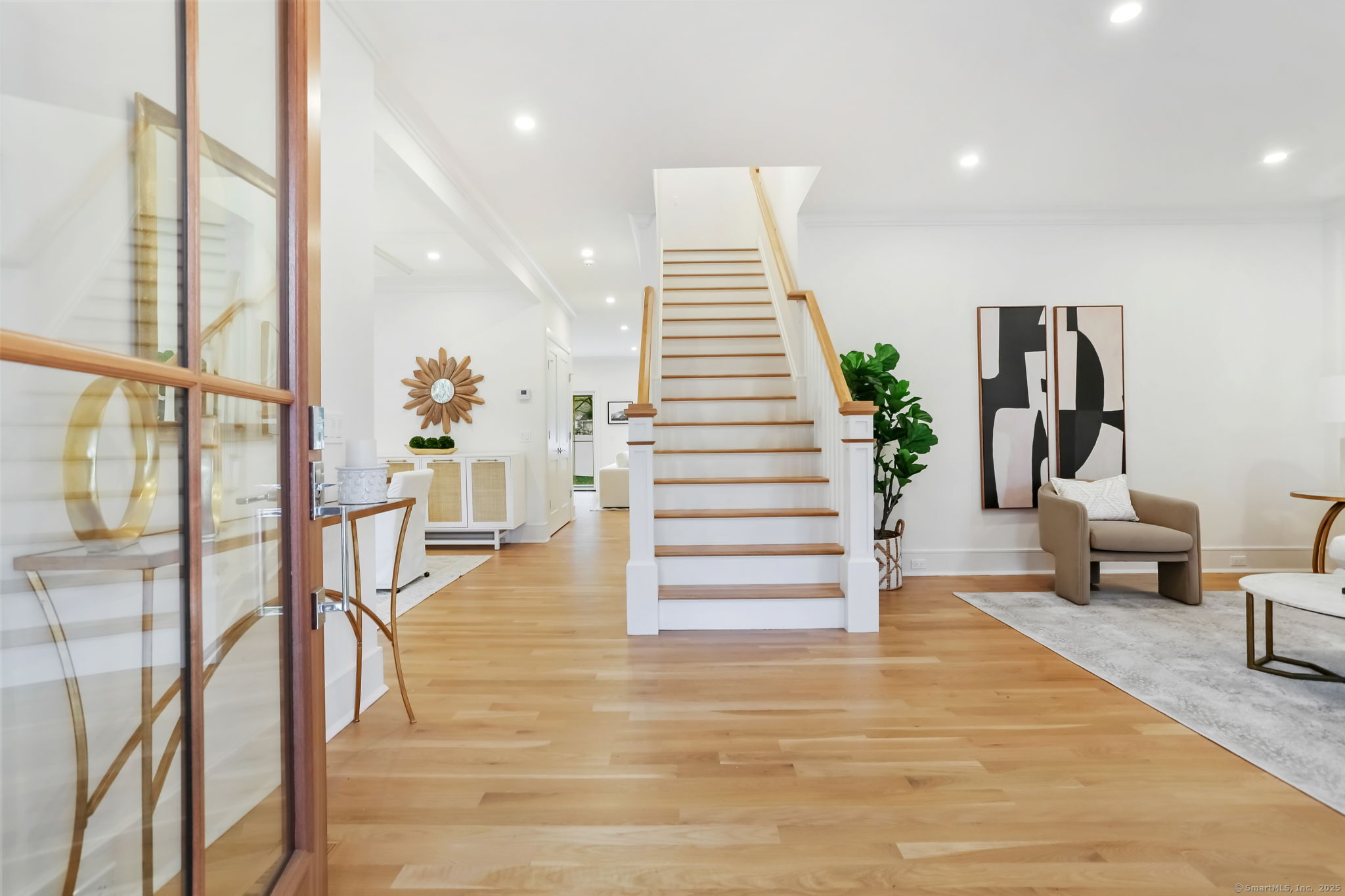 45 Robin Circle Fairfield, CT 06824 - Photo 3 of 40 a view of entryway and hall with wooden floor