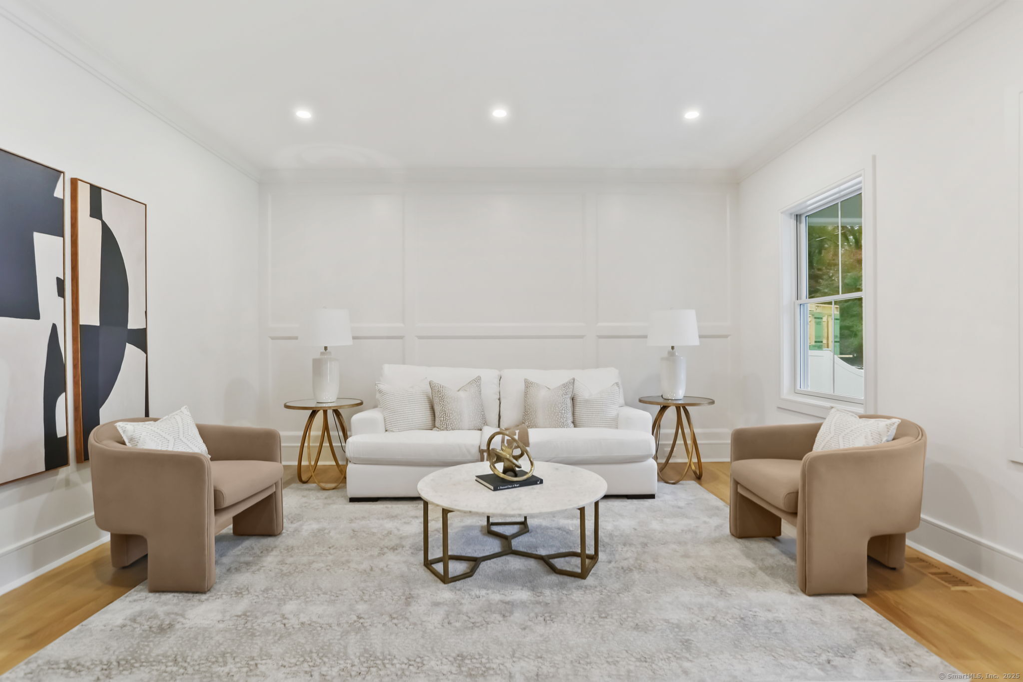 45 Robin Circle Fairfield, CT 06824 - Photo 5 of 40 a living room with furniture and a potted plant