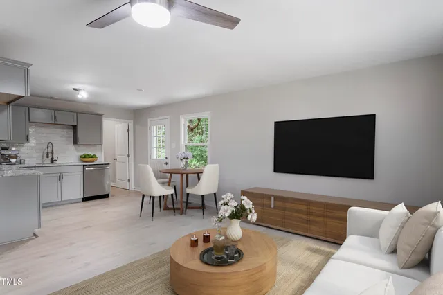 a living room with furniture and a flat screen tv
