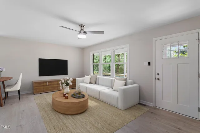 a living room with furniture and a flat screen tv