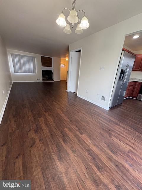 175 Valley Circle Newark, DE 19711 - Photo 4 of 17 a view of an empty room with a window and wooden floor